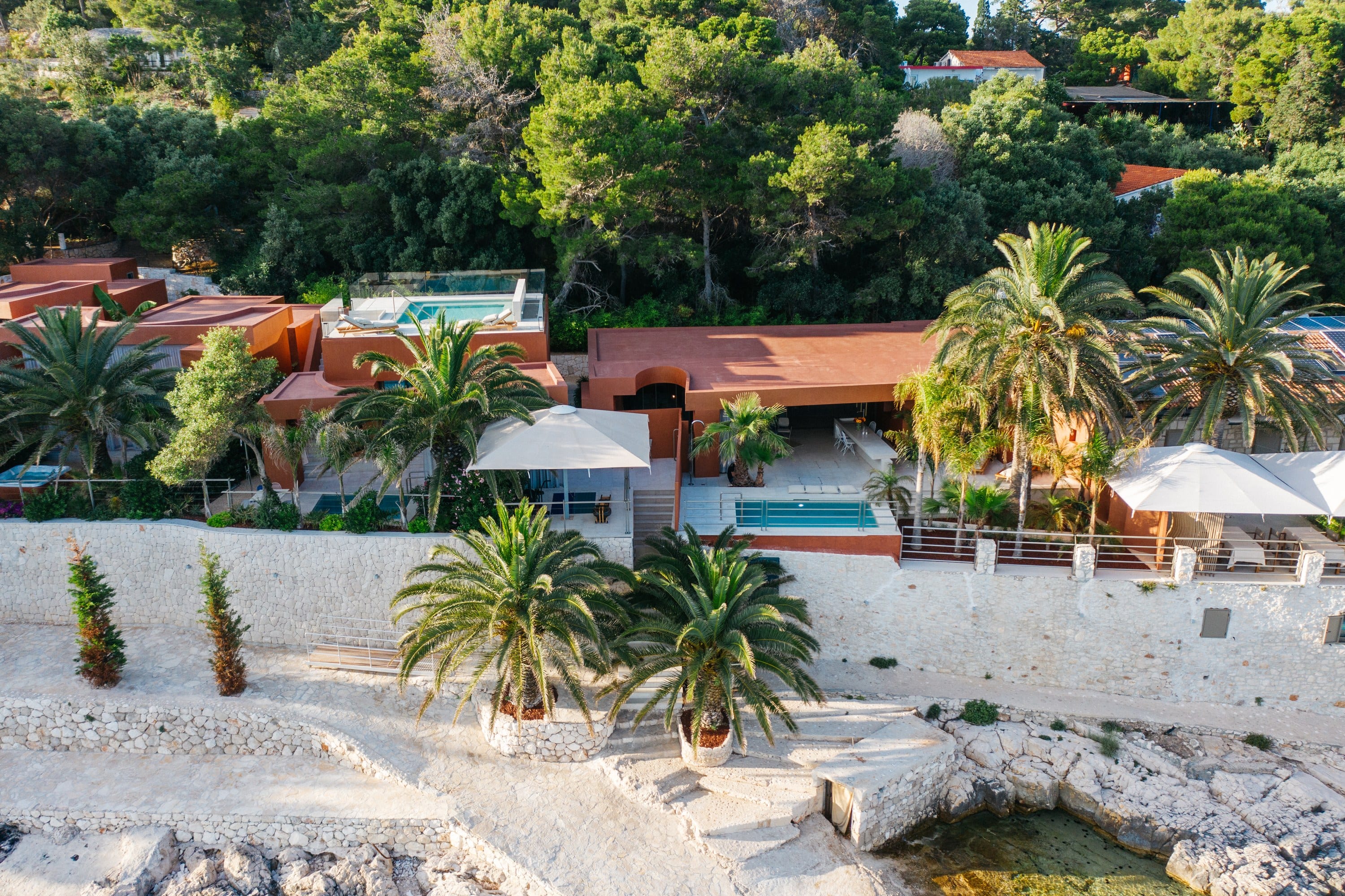 Vinogradišće bay at golden hour. Three generations of stewardship, four contemporary residences below.