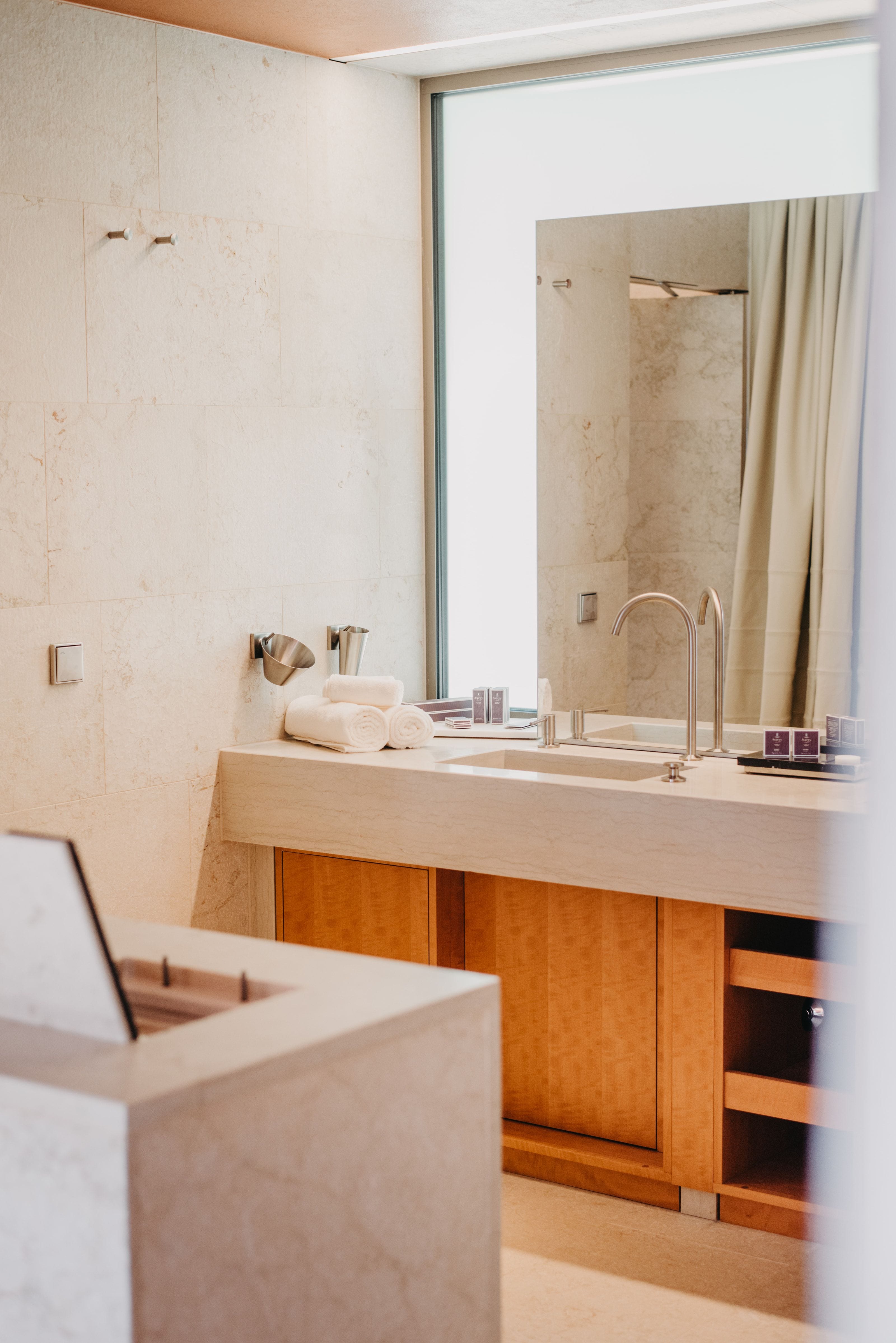 Cloud. Bathroom. Polished concrete, warm light.